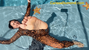 www.carissadumond.com - Carissa on the sun shelf-leopard catsuit, gloves, oval mask, and no mask! thumbnail